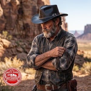 May include: A black cowboy hat with a textured crocodile-skin pattern and a silver buckle, worn with a grey and black plaid long-sleeve shirt, a dark brown leather vest, and a wide brown leather belt featuring intricate embossed floral detailing.