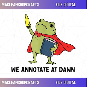 May include: A green cartoon frog wearing a red cape, holding a yellow highlighter in one hand and a dark blue book with colorful page markers in the other. The text "WE ANNOTATE AT DAWN" is printed below the frog, with "MACLEANSHOPCRAFTS" and "FILE DIGITAL" above.