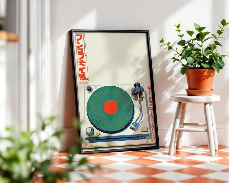 May include: Framed art print featuring a vintage-style turntable with a green record and red center. The artwork includes Japanese text in red and white. The print is displayed on a red and white checkered floor, next to a small white stool with a potted plant.