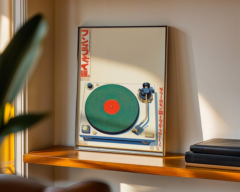 May include: A framed print of a vintage turntable with a green record and red center label. The artwork features Japanese text in red and a cream-colored background. The turntable is white and blue, with gold accents.