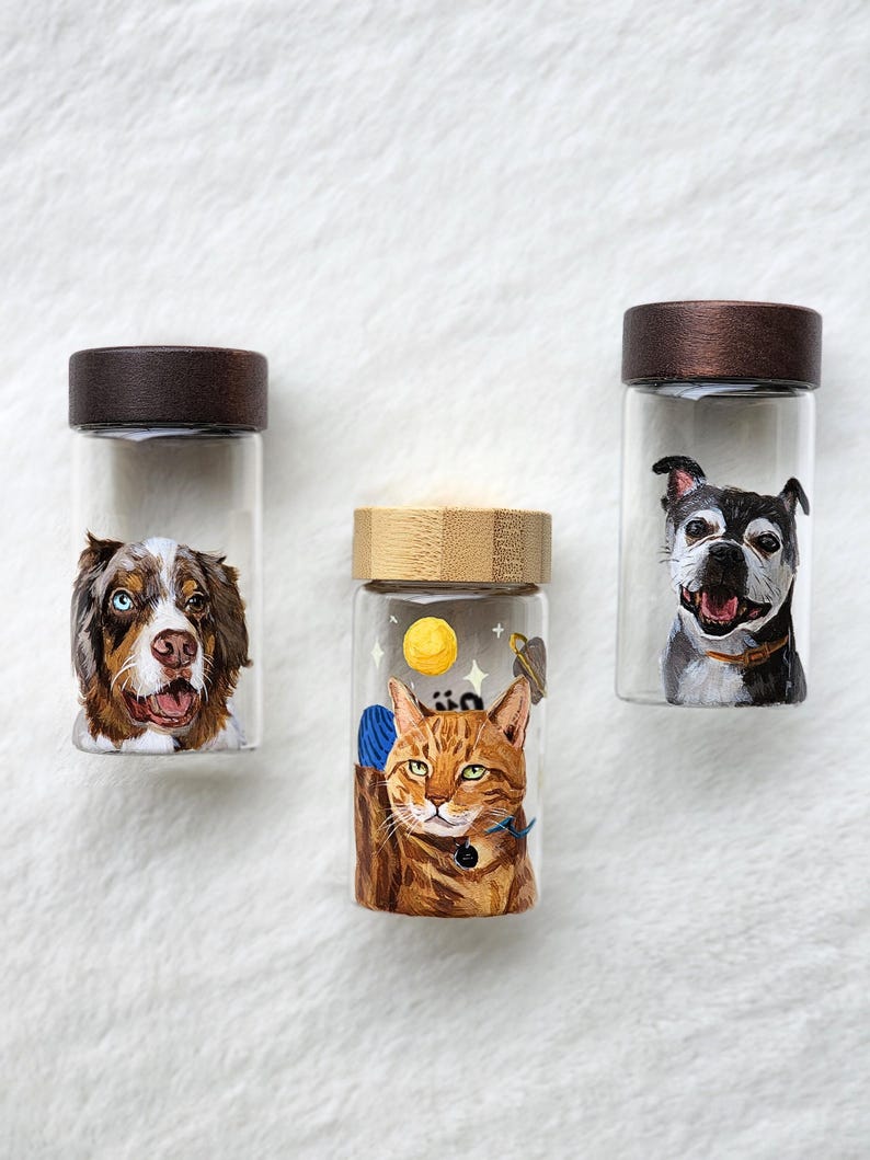 Hand-painted pet memorial jar with realistic portrait on UV-resistant glass, featuring an airtight seal for storing fur or ashes.