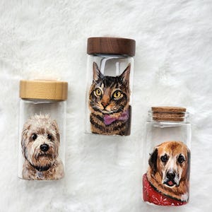 May include: A set of three ceramic mugs with a speckled, matte finish. The mugs are in shades of cream, light gray, and dark gray. Each mug has a simple, minimalist design, perfect for coffee or tea.