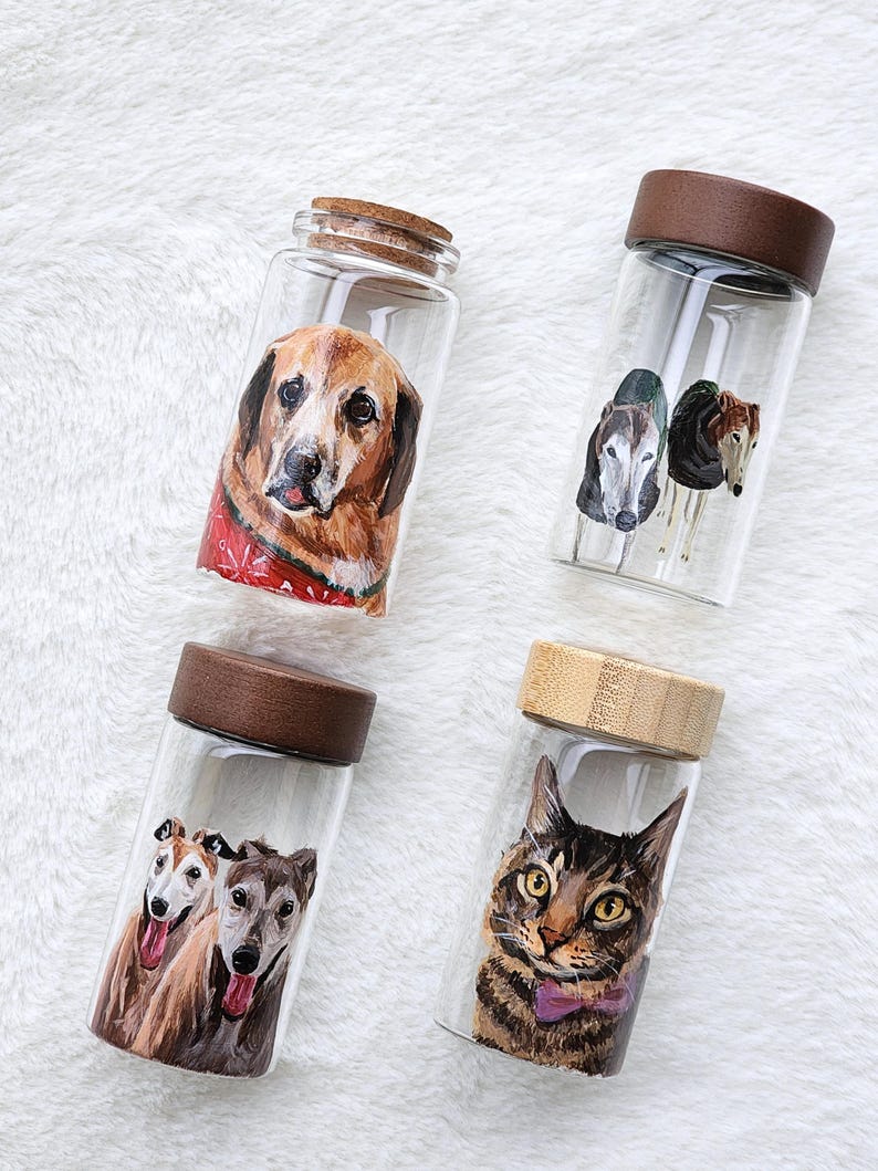 Hand-painted pet memorial jar with realistic portrait on UV-resistant glass, featuring an airtight seal for storing fur or ashes.