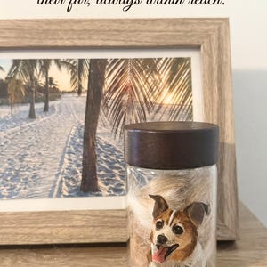 Hand-painted pet memorial jar with realistic portrait on UV-resistant glass, featuring an airtight seal for storing fur or ashes.