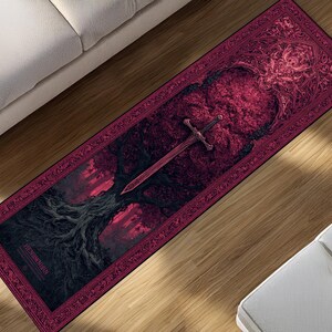 May include: A rectangular rug with a dark red and black design. The rug features a detailed illustration of a sword, a tree, and a forest scene. The border has an ornate pattern, and the text "THE NOWHERE" is visible.