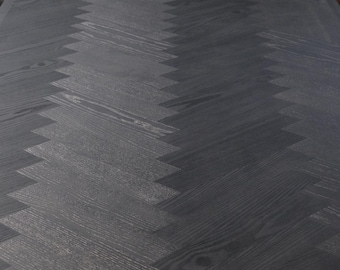 Handcrafted oak tabletop with a black herringbone pattern