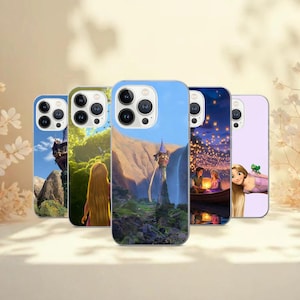May include: A collection of five phone cases featuring scenes from a fairytale. The cases display images of a tower, a waterfall, a boat with lanterns, and a character with long blonde hair. The cases have a glossy finish and are in various colors.