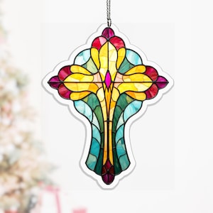 May include: A stained glass cross with a black outline and a chain for hanging. The cross features a vibrant array of colours, including yellow, pink, red, green, and blue. The design is reminiscent of a floral pattern.