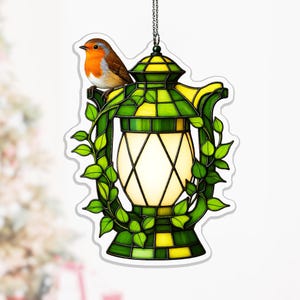 May include: A white ceramic mug with a black handle and the text "But First, Coffee" in a handwritten style. The mug is on a white surface. The mug is approximately 10 cm tall.