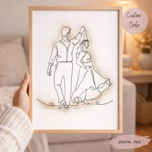 May include: A framed line art print depicts a couple dancing. The artwork is a continuous line drawing in black on a white background. The frame is light brown. The print has the text "Custom Order" and "DIGITAL FILE".