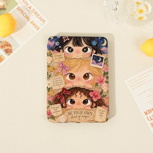 May include: A rectangular tablet case featuring an illustration of three stacked faces with different hair colours, surrounded by flowers, seashells, and stars. The text reads "Dream in Color," "LITTLE JOYS," "Find your own sunshine," "Let your light lead," and "BE YOUR OWN kind of magic."