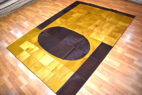 Hand Stitched Cowhide Patchwork Rug, Rustic Farmhouse Carpet (5.58 x 7.87 ft)