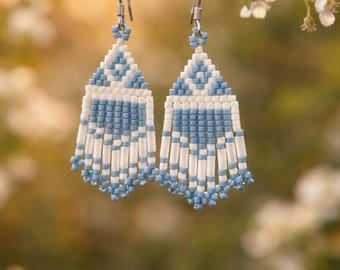 Beautiful Native American blue and white earrings about (1 1/2 “ long & about 1/2” wide)