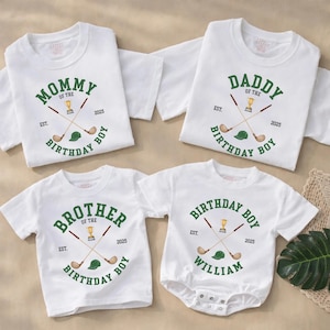 May include: Four white t-shirts and a onesie with green text and graphics. The shirts read "Mommy of the Birthday Boy", "Daddy of the Birthday Boy", and "Brother of the Birthday Boy". The onesie says "Birthday Boy William". Each design includes golf clubs, a trophy, and a hat.