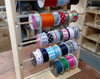 Ribbon rack organizer holds spools of 4 and 5 inch natural