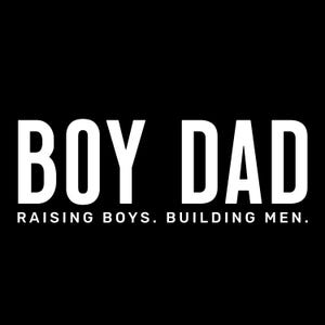 May include: A black background with the words "BOY DAD" in large, bold, white letters. Below, smaller white text reads "RAISING BOYS. BUILDING MEN."