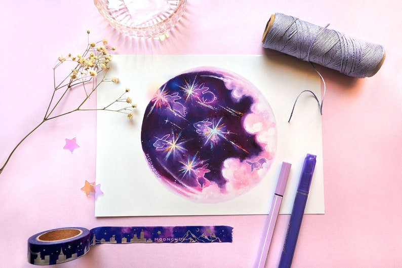 May include: A watercolor painting of a purple moon with white clouds and pink highlights.  Five white rabbits are jumping in front of the moon with sparkling trails behind them.  The painting is on a white background.