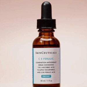 May include: A brown glass bottle of SkinCeuticals C E Ferulic serum with a black dropper. The label includes the text "COMBINATION ANTIOXIDANT SERUM CONTAINING 15% L-ASCORBIC ACID, 1% ALPHA TOCOPHEROL, AND 0.5% FERULIC ACID". The bottle contains 1 fl oz of serum.