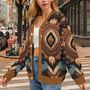 May include: A white ceramic mug with a black handle and the text "But First, Coffee" in a bold, black font. The mug is set against a neutral background, highlighting its simple design.