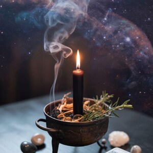 May include: A burning black candle in a bronze bowl with herbs and rosemary. Polished stones and a tarot card deck are placed nearby. Smoke drifts upwards against a starry night sky backdrop.