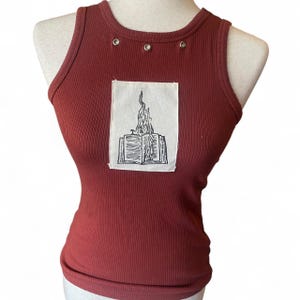 May include: A set of three ceramic mugs with a speckled, matte finish. The mugs are in shades of cream, light gray, and dark gray. Each mug has a simple, minimalist design, perfect for coffee or tea.