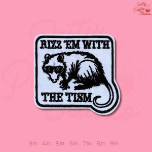 May include: A white embroidered patch with a black and white opossum wearing sunglasses. The text "RIZZ EM WITH THE TISM" is above and below the opossum. The patch is approximately 3 inches to 9 inches in size.