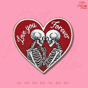 May include: Embroidered patch in the shape of a red heart with the words "Love you Forever" in white script. The patch features two skeletons embracing. The patch is available in sizes from 3 inches to 9 inches.