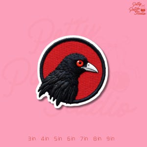 May include: A white ceramic mug with a black handle and the text "But First, Coffee" in a black, bold font. The mug is on a white surface.