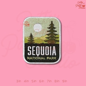 May include: Embroidered patch featuring a scenic view of Sequoia National Park. The design includes two pine trees, a full moon, and the park's name in white lettering on a black background. The patch is rectangular with rounded corners.