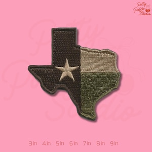 May include: Embroidered patch in the shape of the state of Texas, featuring a star and a split design of olive green, tan, and dark brown. The patch measures from 3 to 9 inches in length.