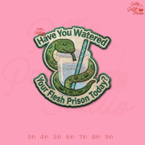 May include: A white ceramic mug with a black handle and the text "But First, Coffee" in a handwritten style. The mug is on a white surface. The mug is approximately 4 inches tall.