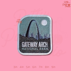 May include: Embroidered patch featuring the Gateway Arch National Park. The patch has a rectangular shape with a light blue background, a black arch, and the text "GATEWAY ARCH NATIONAL PARK". The patch measures 3 inches to 9 inches.