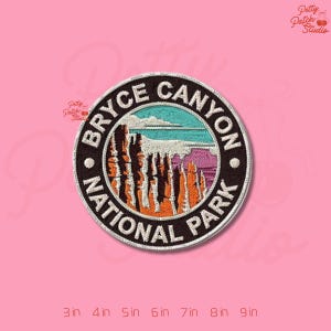 May include: Embroidered patch featuring a scenic view of Bryce Canyon National Park. The circular patch has a black border with the words "BRYCE CANYON NATIONAL PARK". The image inside depicts the canyon's rock formations in shades of orange, brown, and purple, with a blue sky and water.