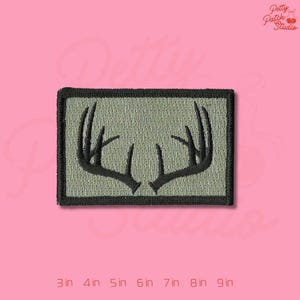 May include: A set of three ceramic mugs with a speckled, matte finish. The mugs are in shades of cream, light gray, and dark gray. Each mug has a simple, minimalist design, perfect for coffee or tea.