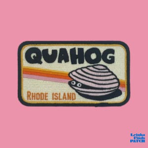 May include: A rectangular patch with the word "QUAHOG" in black, above a cartoon clam with pink and black stripes. Below the clam is the text "RHODE ISLAND". The patch has a retro design with orange and yellow stripes.