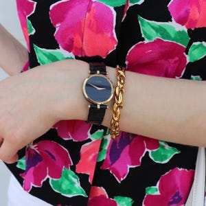 Vintage GUCCI black and gold watch