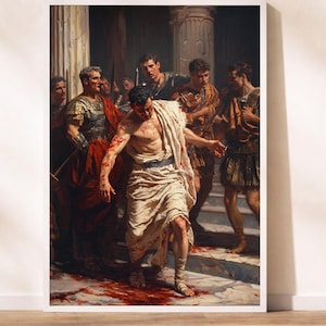 May include: A framed print of a classical painting depicting a dramatic scene. A man in a white toga, covered in blood, is surrounded by other figures in Roman attire. The artwork features a detailed depiction of a historical event.