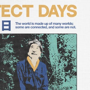 May include: Poster with the text "ECT DAYS" in gold letters and a Japanese character. Below, the text reads, "The world is made up of many worlds; some are connected, and some are not." A man in a blue shirt looks up.