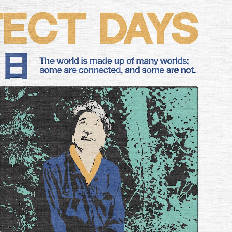 May include: Poster with the text "ECT DAYS" in gold letters and a Japanese character. Below, the text reads, "The world is made up of many worlds; some are connected, and some are not." A man in a blue shirt looks up.