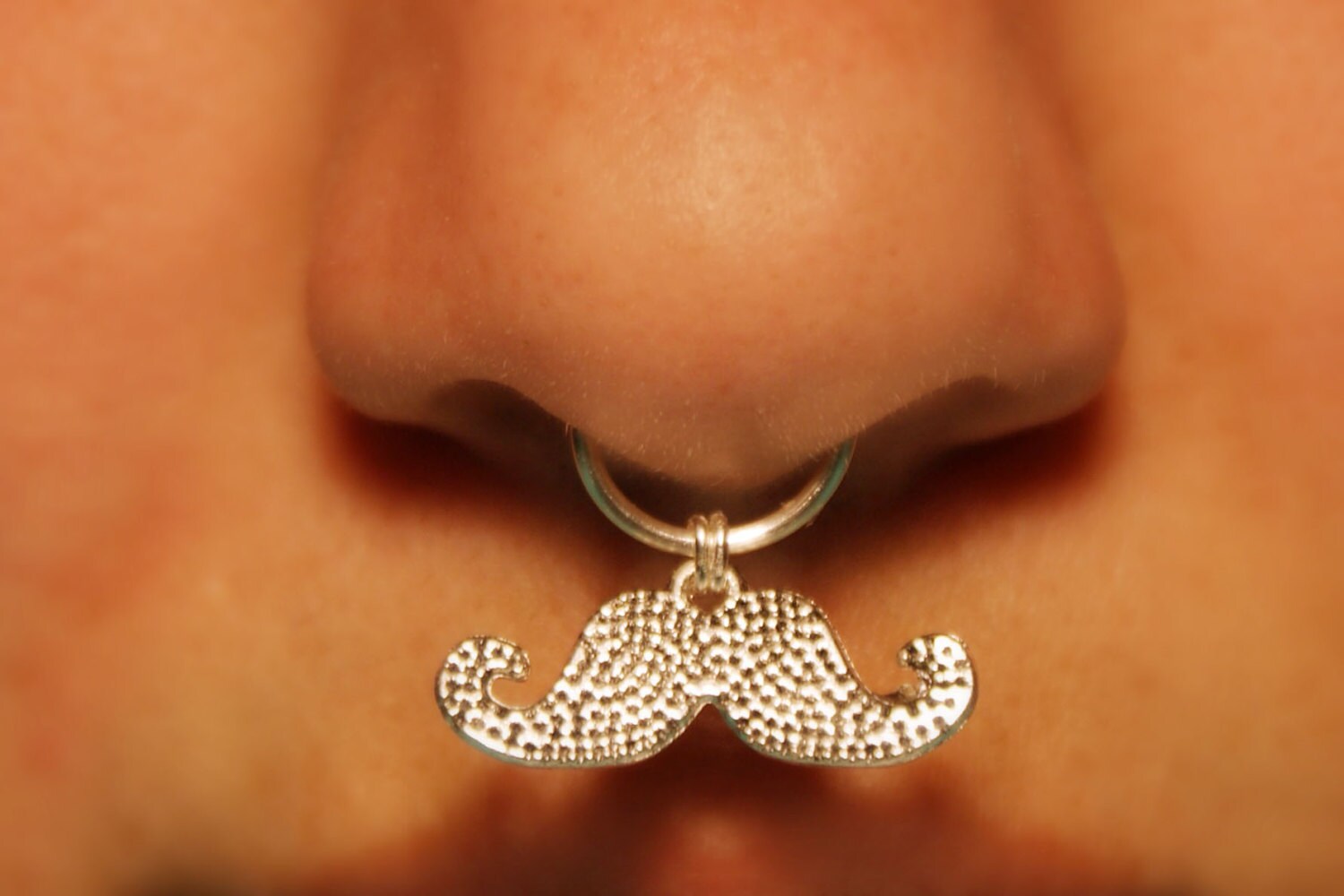 mustache septum piercing