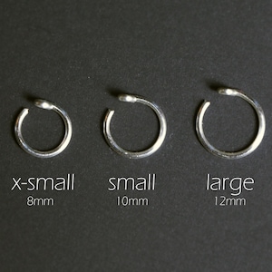 silver lip cuff sizing chart. Extra small 8mm, small 10mm, and large 12mm. No piercing required