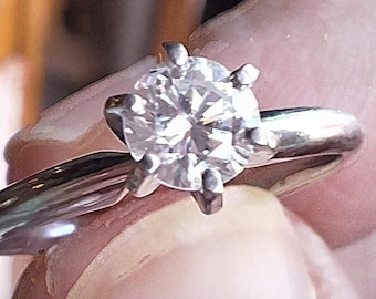 Classic Platinum Solitaire Engagement Ring with Natural Modern Round Brilliant Cut diamond