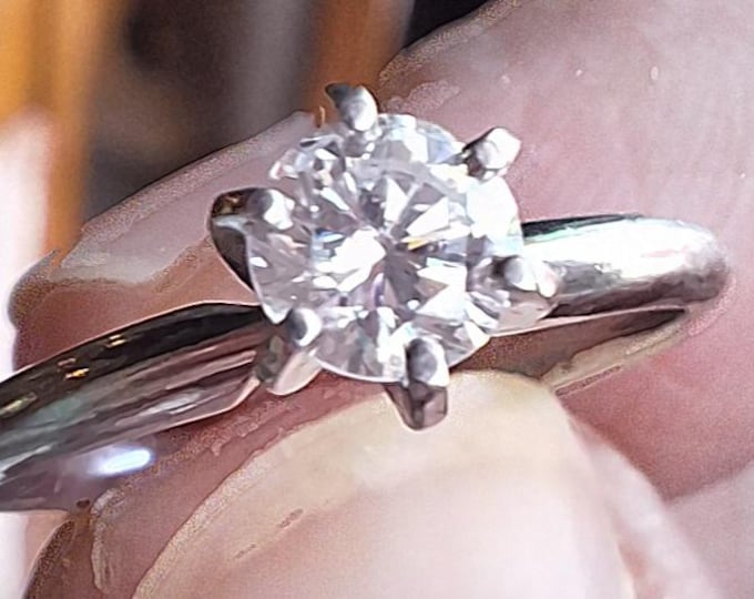 Classic Platinum Solitaire Engagement Ring with Natural Modern Round Brilliant Cut diamond