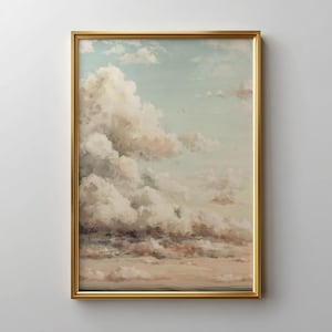 May include: A framed art print featuring a cloudy sky with shades of white, beige, and light blue. The artwork is enclosed in a gold-colored frame, adding a touch of elegance to the landscape painting.