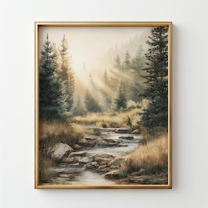 May include: A framed landscape painting depicts a serene forest scene. A stream flows through the foreground, surrounded by rocks and tall grass. The background features tall evergreen trees and a misty, sunlit sky. The frame is gold.