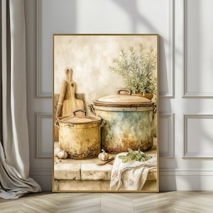May include: A framed print featuring a still life of kitchen items. Two aged cooking pots with lids are displayed, one yellow and one blue-green. Wooden cutting boards and fresh herbs are also visible. The artwork has a vintage, rustic aesthetic.