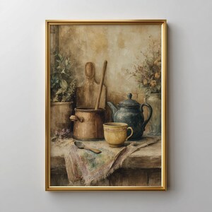 May include: A framed watercolor painting of a kitchen still life. A copper pot, wooden spoon, and cutting board are next to a blue teapot and yellow teacup. A vase of flowers and potted plants are also visible.
