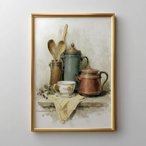 May include: A framed watercolor painting of kitchenware. It features a brown jar with wooden spoons, a teal pitcher, a red teapot, and a teacup with a yellow floral design. A yellow cloth and berries are also present.