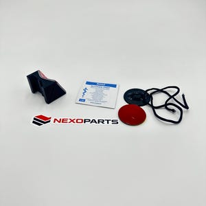 May include: An assortment of automotive parts, including a black and red bracket, a red circular sticker, a black disc with a cord, and a small packet labeled "Alcohol Prep". The Nexoparts logo is also visible.