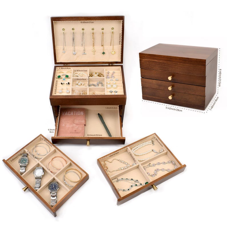 May include: A dark wood jewelry box with multiple compartments and drawers. The top section displays necklaces, while the middle section holds rings and earrings. The bottom drawer is open, revealing a notebook and pen. Additional drawers showcase watches, bracelets, and necklaces.
